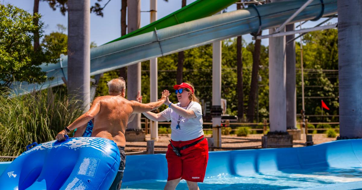 Lifeguard high five older man